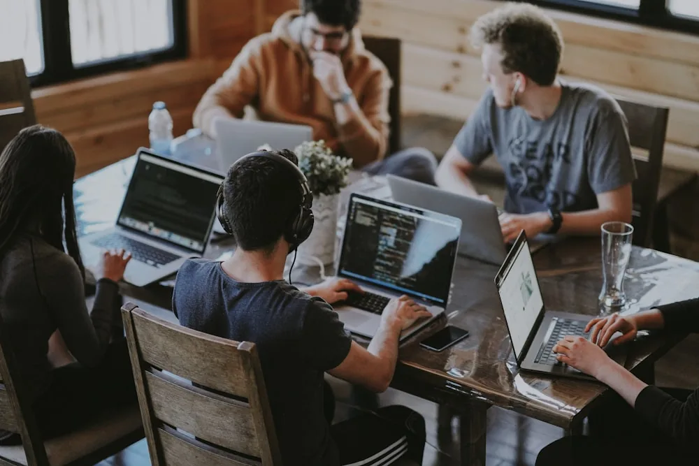 Trango Tech Android engineering team collaborating around a workstation